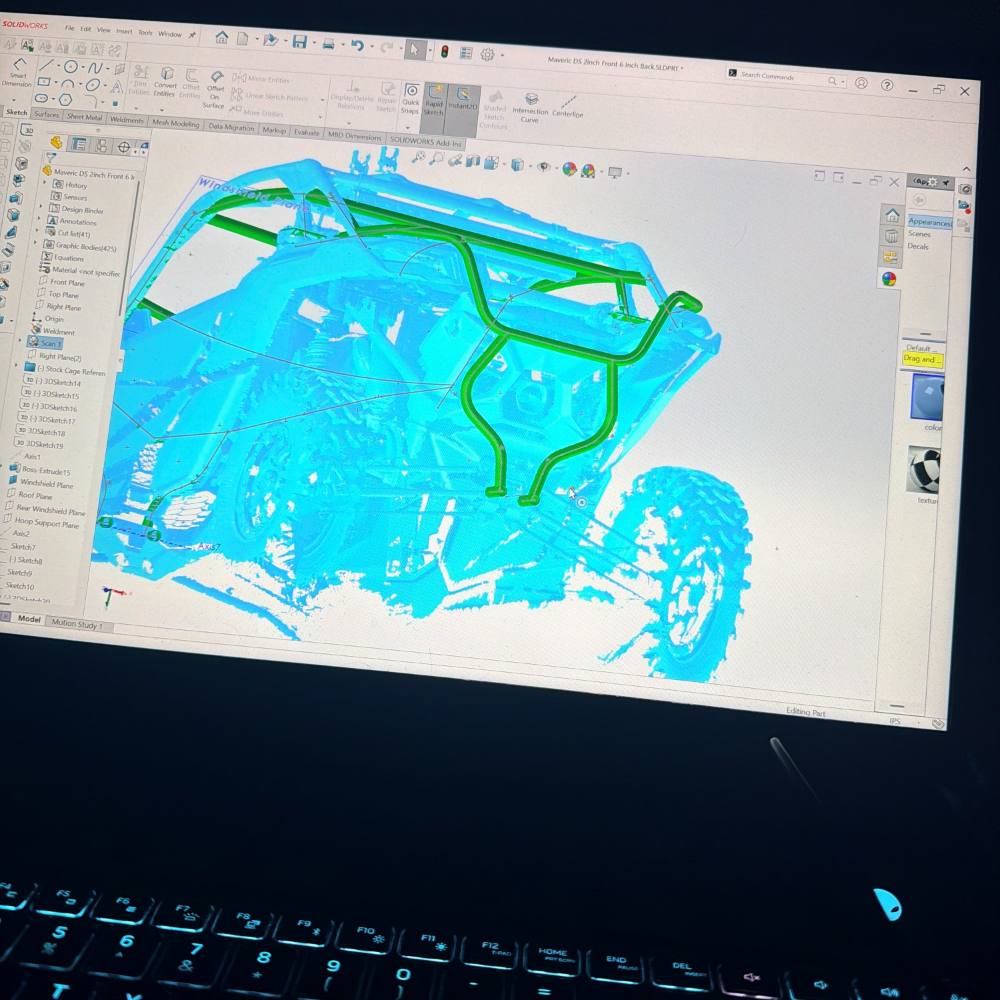 A scanned side by side in CAD, new cage tubes modelled onto the scan in green