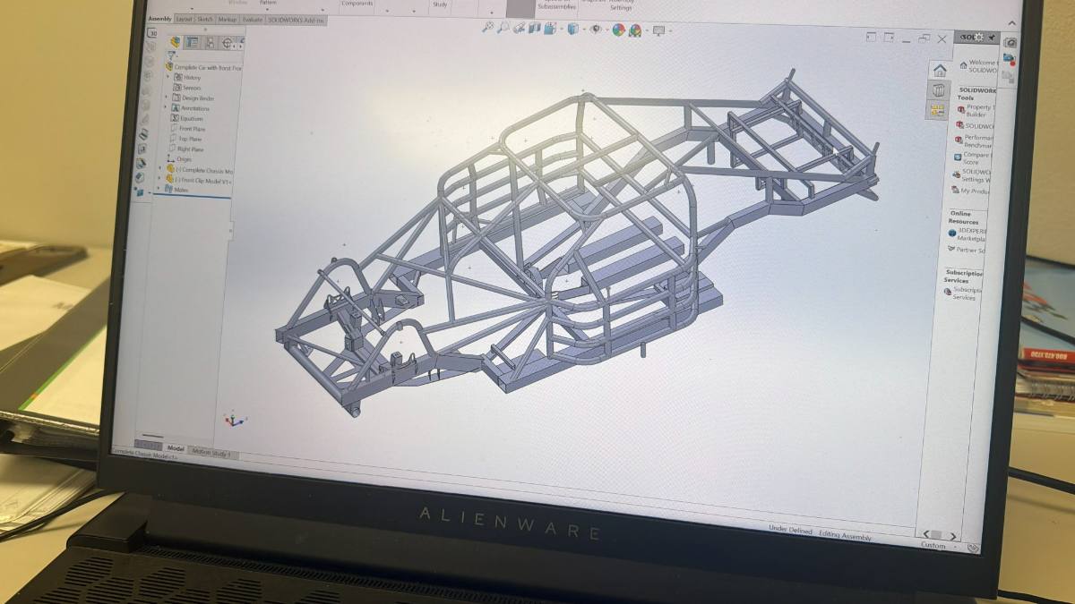 A complete race car chassis and front clip assembled in CAD