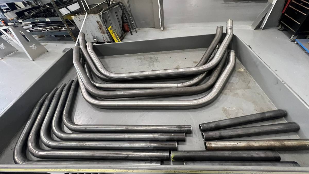 CNC bent and cut tube sorted in the tray, ready to weld up