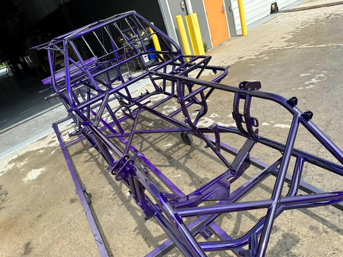 A race chassis finished in purple powder coat